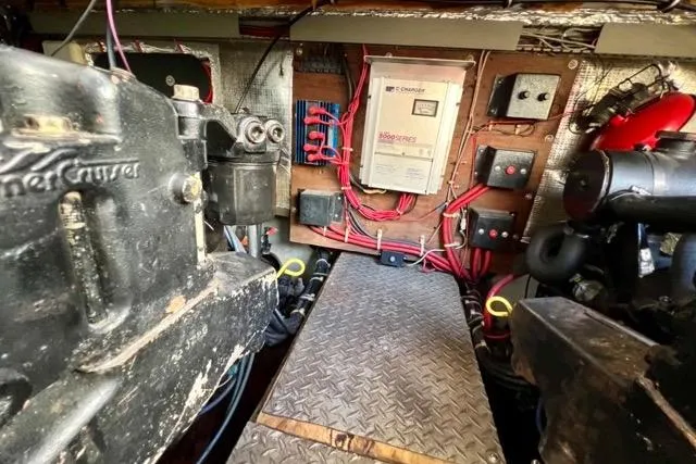 Slide: The Image of Engine room of a 1995 Regal Commodore 400 boat, featuring mechanical components and wiring. - 18