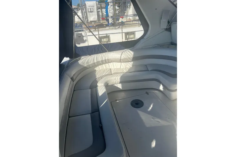 Slide: The Image of Luxurious seating area on a 1995 Regal Commodore 400 yacht, featuring elegant curved design. - 20