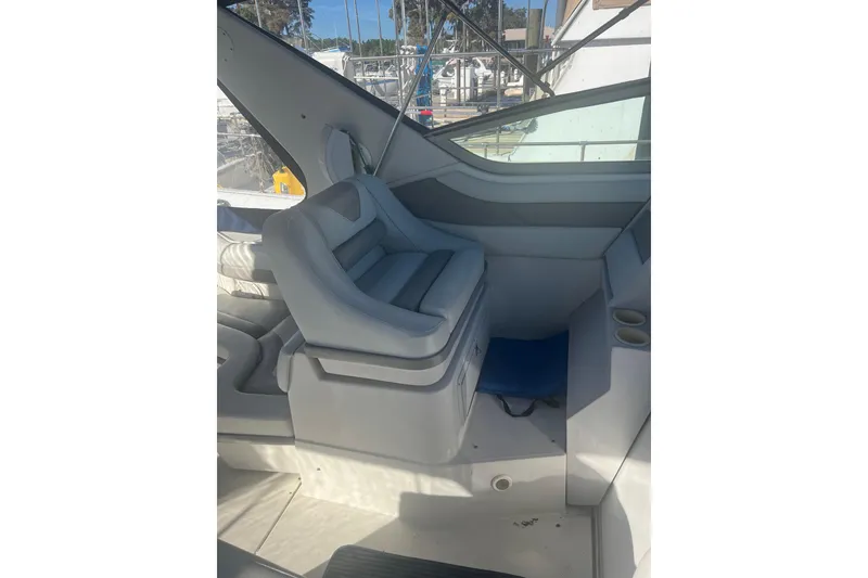 Slide: The Image of Interior of a 1995 Regal Commodore 400 boat with cushioned seating. - 22
