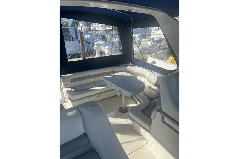 Slide: The Image of Interior of a 1995 Regal Commodore 400 yacht with seating and table. - 23
