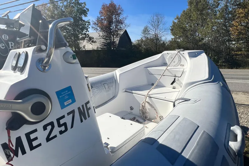 Slide: The Image of 2007 Caribe 15DL inflatable boat with registration ME 257 NF, parked outdoors. - 10