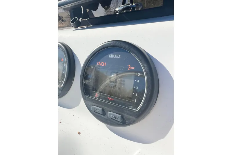 Slide: The Image of Yamaha tachometer on a 2007 Caribe 15DL boat dashboard, displaying RPM and indicators. - 12
