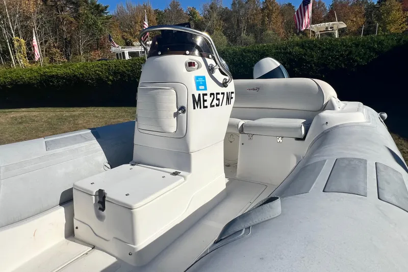 Slide: The Image of 2007 Caribe 15DL inflatable boat with console, parked outdoors on grass. - 8