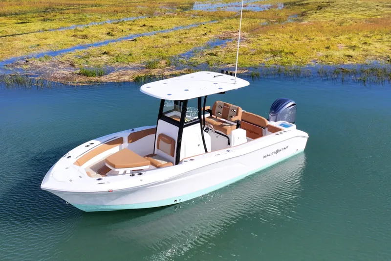 Slide: The Image of 2026 NauticStar 242 Offshore boat on calm water, featuring sleek design and modern amenities. - 11