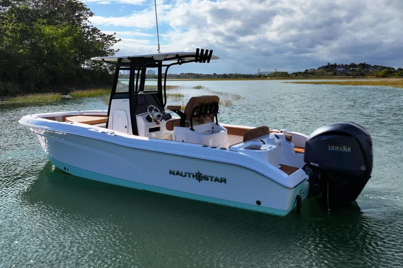Slide: The Image of 2026 NauticStar 242 Offshore boat on calm water, featuring Yamaha outboard motor. - 5