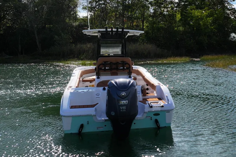 Slide: The Image of 2026 NauticStar 242 Offshore boat with Yamaha 300 V6 engine on water. - 6