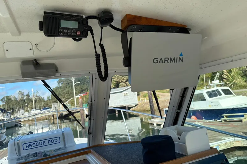 Slide: The Image of Interior of 2005 Albin 28 Tournament Express with Garmin equipment and rescue pod visible. - 21