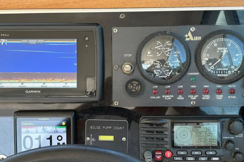 Slide: The Image of Dashboard of a 2005 Albin 28 Tournament Express with Garmin navigation and control gauges. - 23