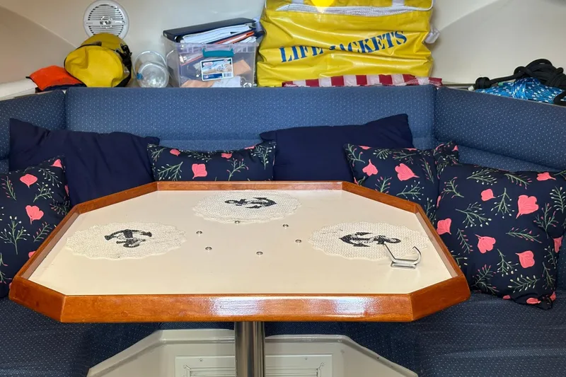 Slide: The Image of Cozy interior of 2005 Albin 28 Tournament Express with floral cushions and life jackets. - 27