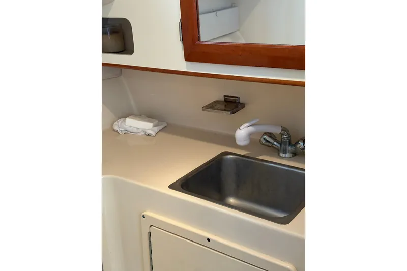 Slide: The Image of 2005 Albin 28 Tournament Express boat interior with sink and countertop. - 29