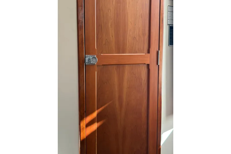 Slide: The Image of Wooden cabin door on 2005 Albin 28 Tournament Express boat. - 31