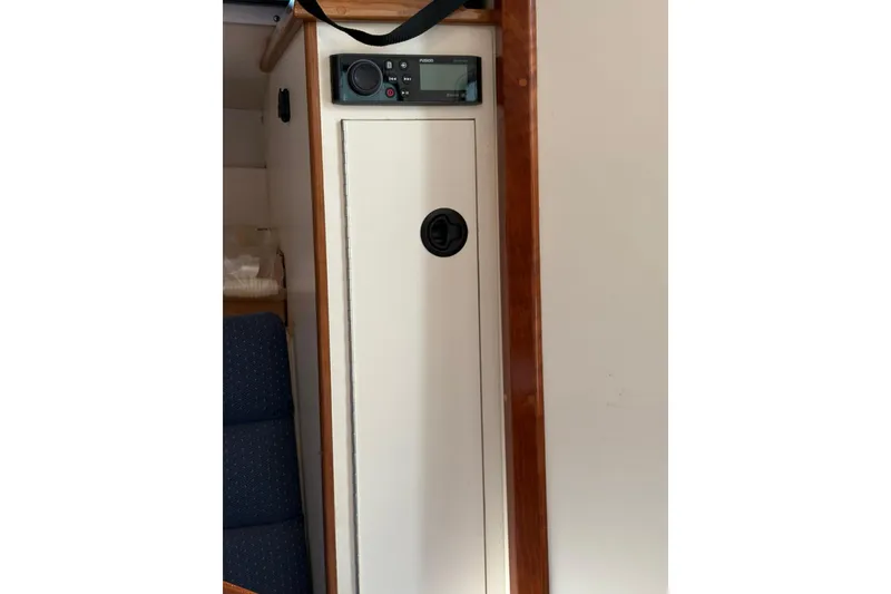 Slide: The Image of Interior view of 2005 Albin 28 Tournament Express with control panel and storage. - 32