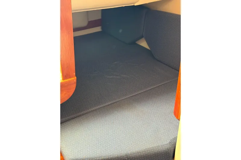 Slide: The Image of 2005 Albin 28 Tournament Express cabin interior with cushioned seating. - 35