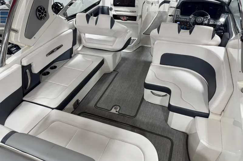 Slide: The Image of 2019 Chaparral 347 SSX boat interior with luxurious white seating and modern dashboard. - 15