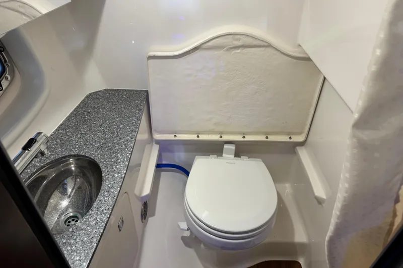 Slide: The Image of 2019 Chaparral 347 SSX boat bathroom with sink and toilet. - 18