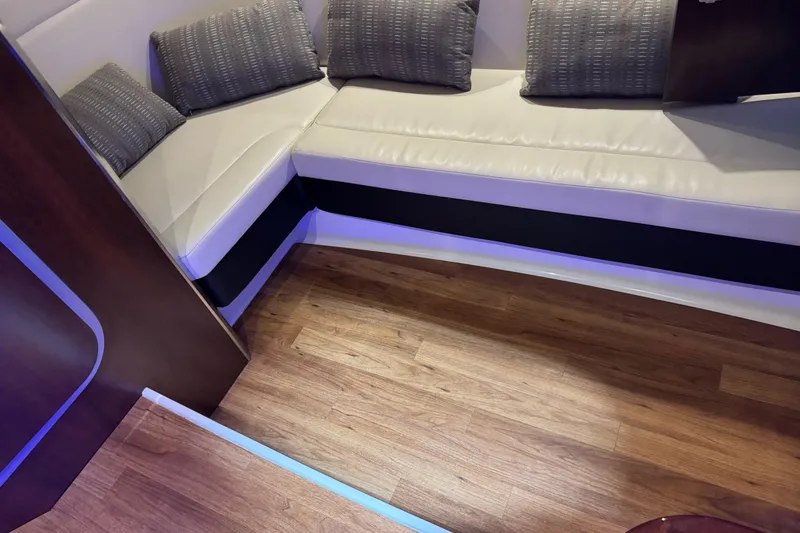 Slide: The Image of Luxurious interior of 2019 Chaparral 347 SSX with plush seating and wooden flooring. - 19