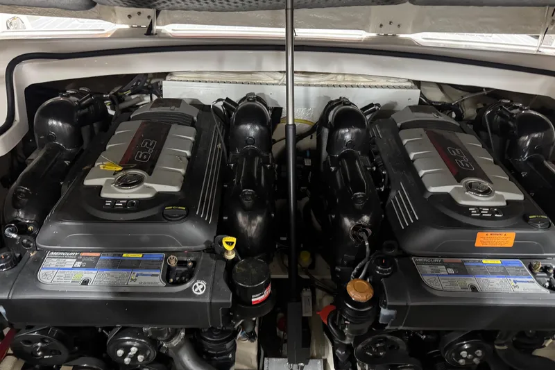 Slide: The Image of Twin Mercury engines in a 2019 Chaparral 347 SSX boat engine compartment. - 22