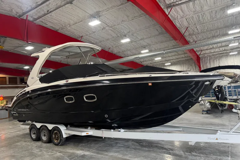 Slide: The Image of 2019 Chaparral 347 SSX boat on trailer in indoor storage facility. - 23