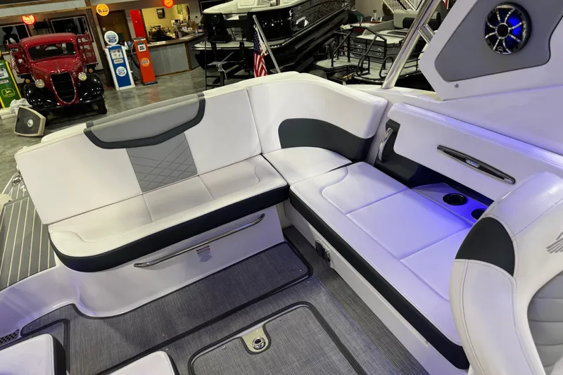 Slide: The Image of 2019 Chaparral 347 SSX boat interior with sleek white seating and modern design. - 8