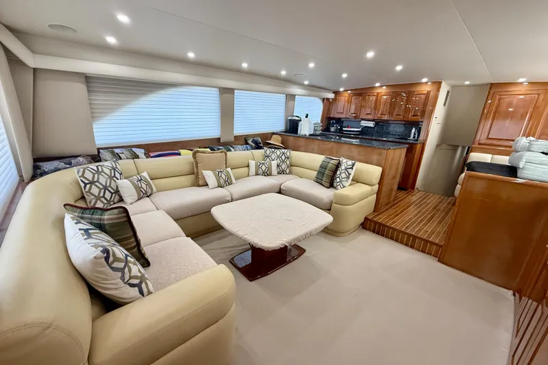 Slide: The Image of Luxurious interior of 2004 Viking 65 Convertible yacht with plush seating and elegant wood finishes. - 12