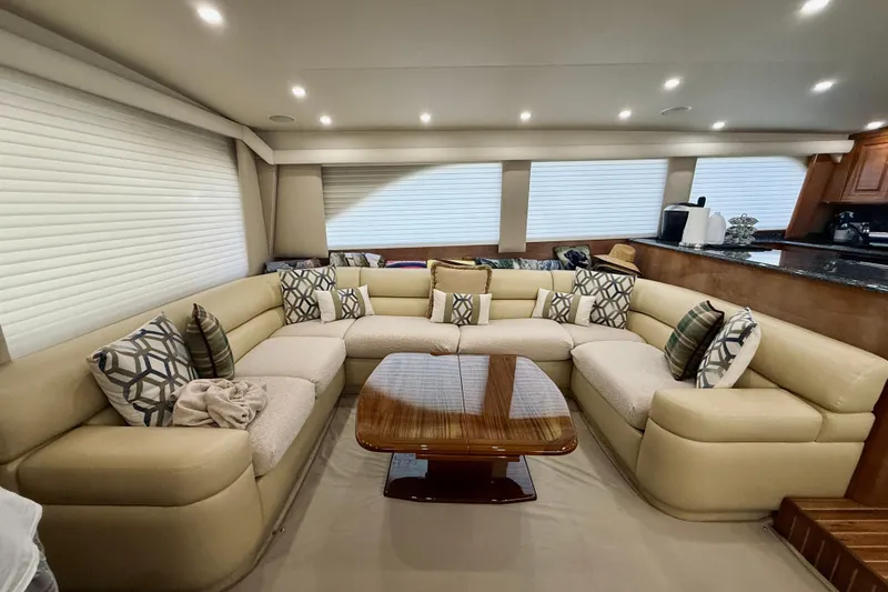 Slide: The Image of Luxurious interior of a 2004 Viking 65 Convertible yacht with plush seating and elegant decor. - 13