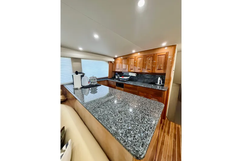 Slide: The Image of Luxurious kitchen interior of 2004 Viking 65 Convertible yacht with granite countertops. - 20