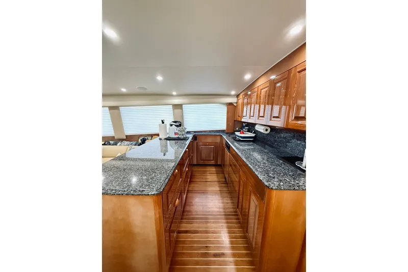 Slide: The Image of Luxurious kitchen interior of 2004 Viking 65 Convertible yacht with granite countertops. - 21