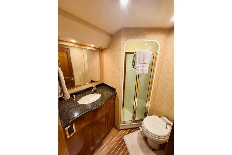 Slide: The Image of Luxurious bathroom in 2004 Viking 65 Convertible yacht with elegant fixtures and modern design. - 36