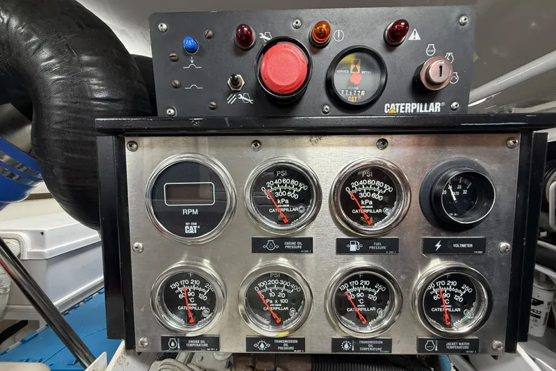 Slide: The Image of Control panel of a 2004 Viking 65 Convertible yacht with Caterpillar gauges. - 45