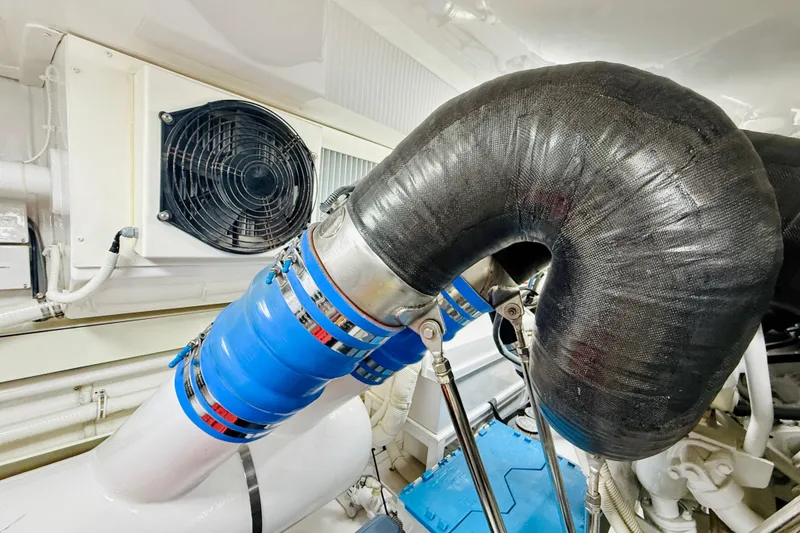 Slide: The Image of Engine room of 2004 Viking 65 Convertible with ventilation system and insulated pipes. - 46
