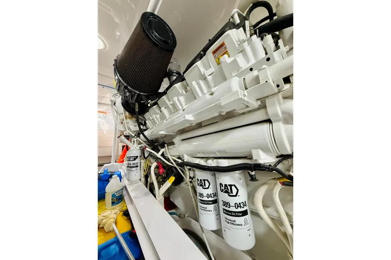 Slide: The Image of Engine room of 2004 Viking 65 Convertible yacht with CAT marine oil filters. - 63