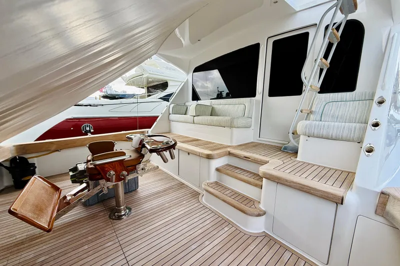 Slide: The Image of Luxurious 2004 Viking 65 Convertible yacht interior with seating and fishing chair. - 68
