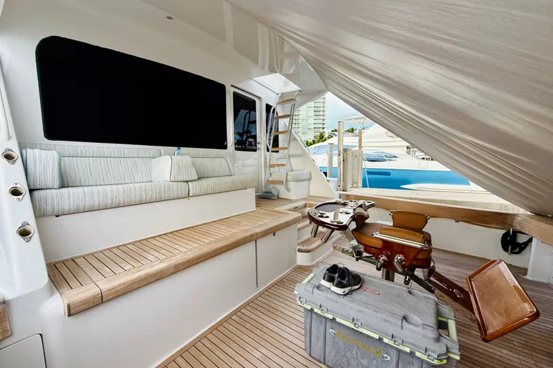 Slide: The Image of Luxurious 2004 Viking 65 Convertible yacht interior with seating and fishing equipment. - 69