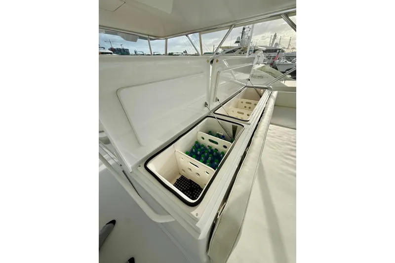 Slide: The Image of Storage compartments on 2004 Viking 65 Convertible yacht, open with beverages inside. - 78