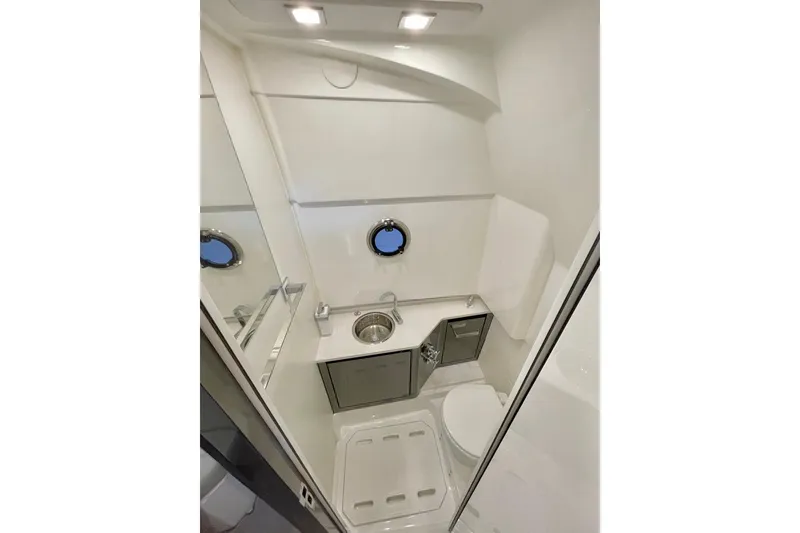 Slide: The Image of 2026 Schaefer V33 yacht helm with advanced navigation controls and sleek steering wheel. - 15