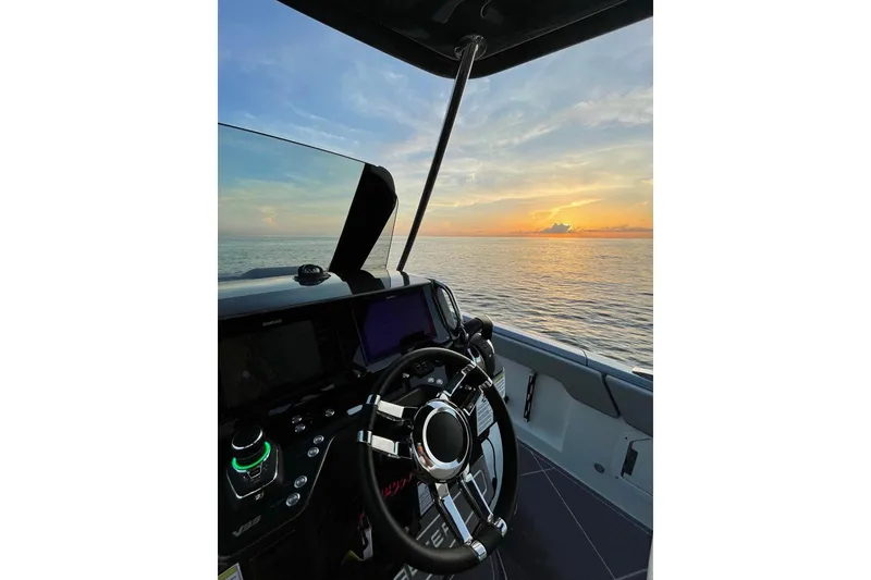 Slide: The Image of Open refrigerator and storage compartments on Schaefer V33 yacht, 2026 model, with wooden flooring. - 17