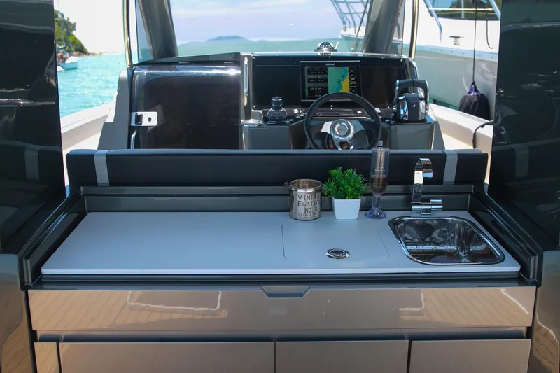 Slide: The Image of Helm of 2026 Schaefer V34 yacht with modern controls and navigation displays. - 5