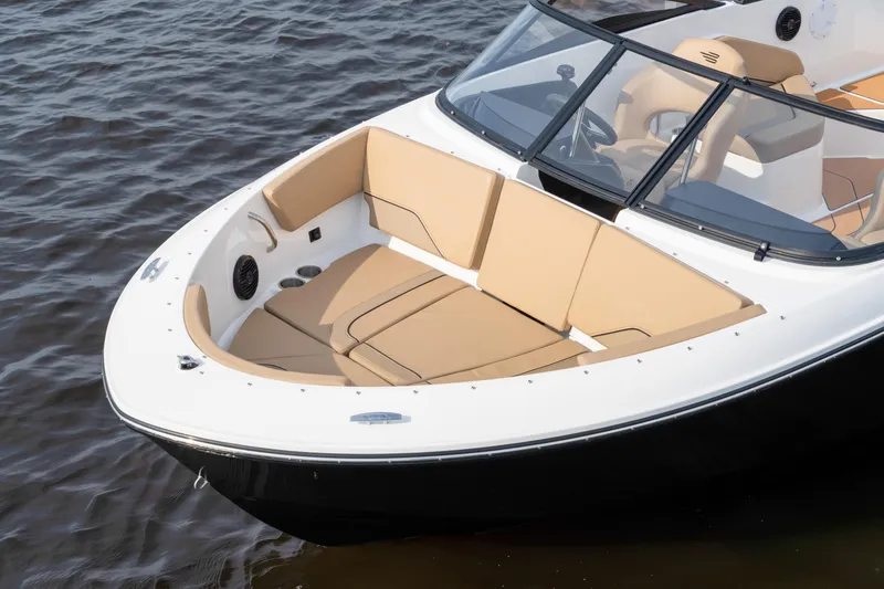 Slide: The Image of 2026 Bayliner V20 boat with tan seating, on calm water. - 3