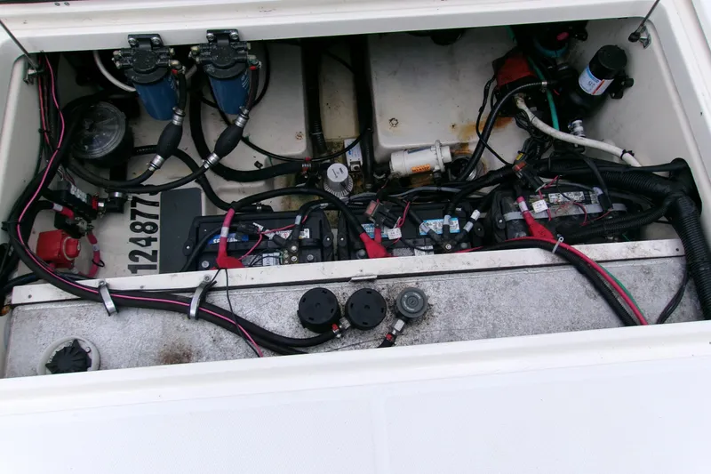 Slide: The Image of Engine compartment of a 2013 Boston Whaler 315 Conquest, showing wiring and components. - 20