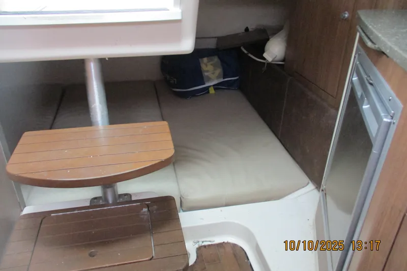 Slide: The Image of Interior cabin of 2013 Boston Whaler 315 Conquest with wooden steps and compact fridge. - 25