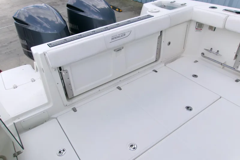 Slide: The Image of 2013 Boston Whaler 315 Conquest boat deck with Yamaha outboard engines. - 34