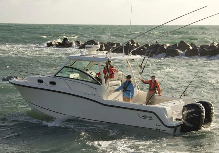 Slide: The Image of 2013 Boston Whaler 315 Conquest helm with Garmin navigation, modern interior design. - 6