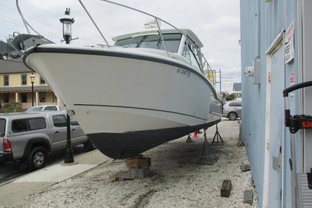 Slide: The Image of Bow view of 2013 Boston Whaler 315 Conquest with anchor and railing. - 8