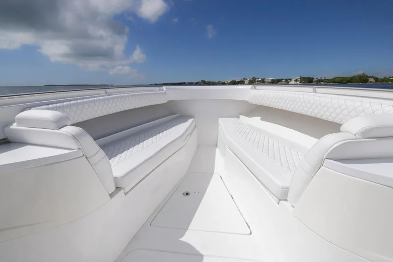 Slide: The Image of Luxurious seating on 2023 HCB 39 Speciale boat, featuring elegant white upholstery. - 10