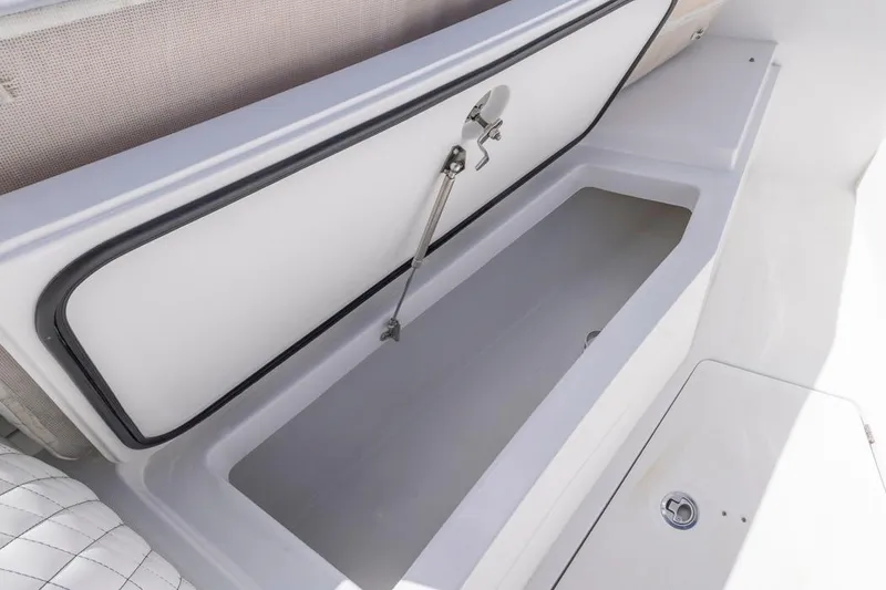 Slide: The Image of 2023 HCB 39 Speciale boat storage compartment with open lid. - 15