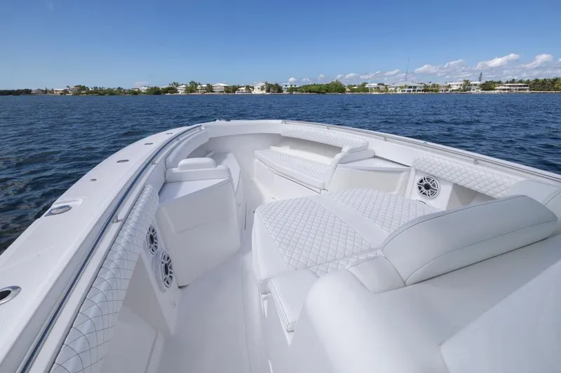 Slide: The Image of Luxurious 2023 HCB 39 Speciale boat interior with white seating on a calm blue sea. - 22