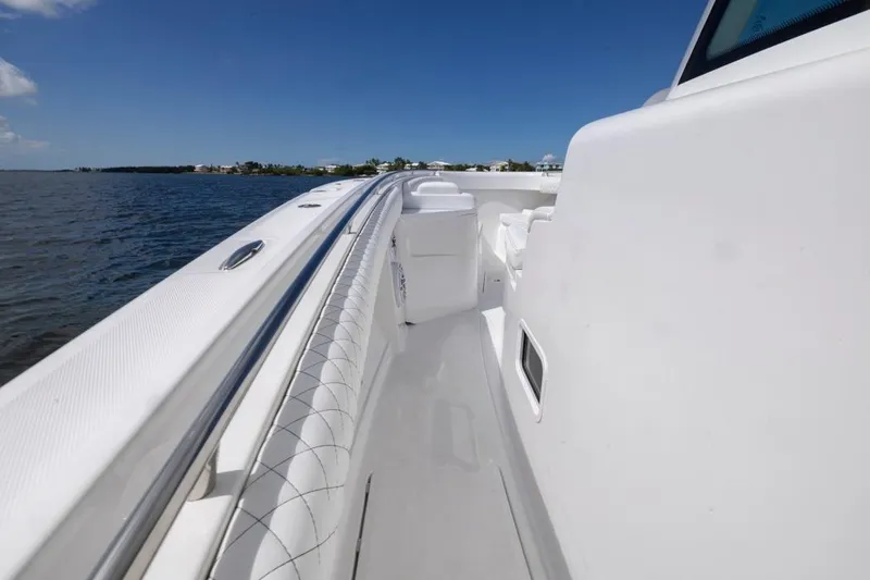 Slide: The Image of 2023 HCB 39 Speciale boat deck with ocean view under clear blue sky. - 23
