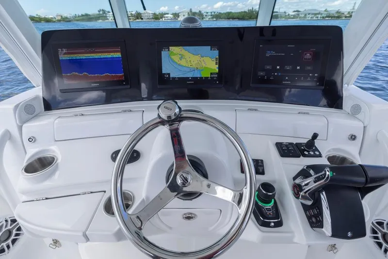Slide: The Image of 2023 HCB 39 Speciale boat dashboard with advanced navigation and control systems. - 31