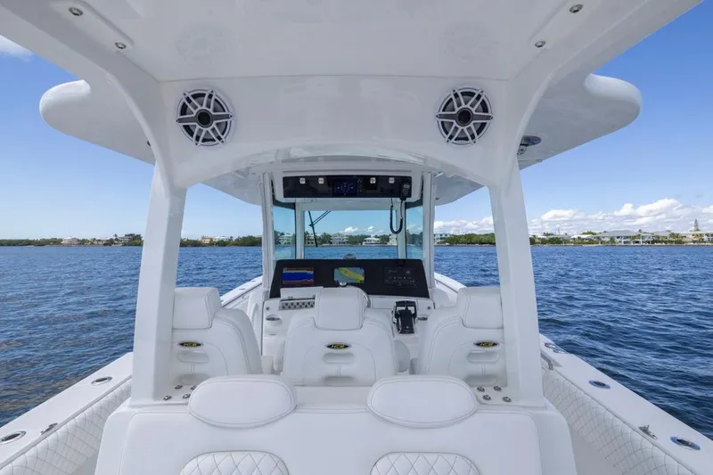 Slide: The Image of 2023 HCB 39 Speciale boat interior with advanced navigation system on open water. - 37