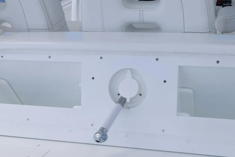 Slide: The Image of 2023 HCB 39 Speciale boat interior with white seating and control panel. - 40